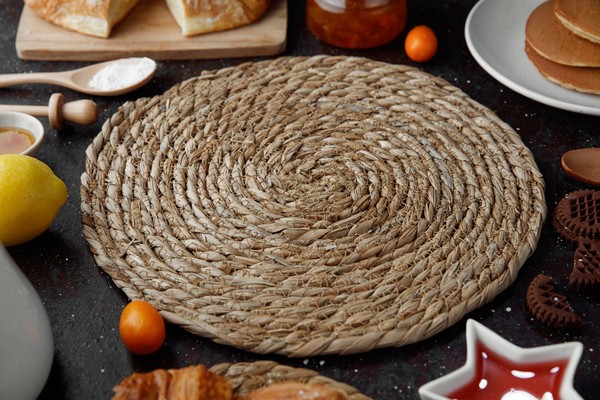 Rustic wedding table styled with jute coasters and florals